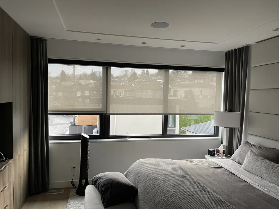 Roller shades, framed with drapery