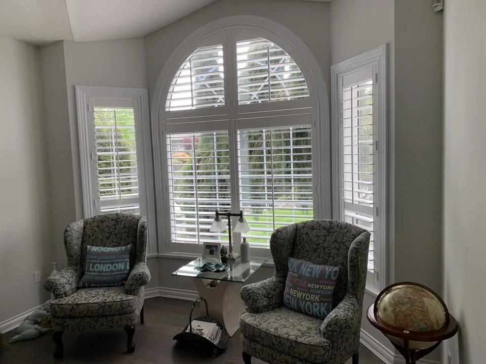 An arched window in a sitting room