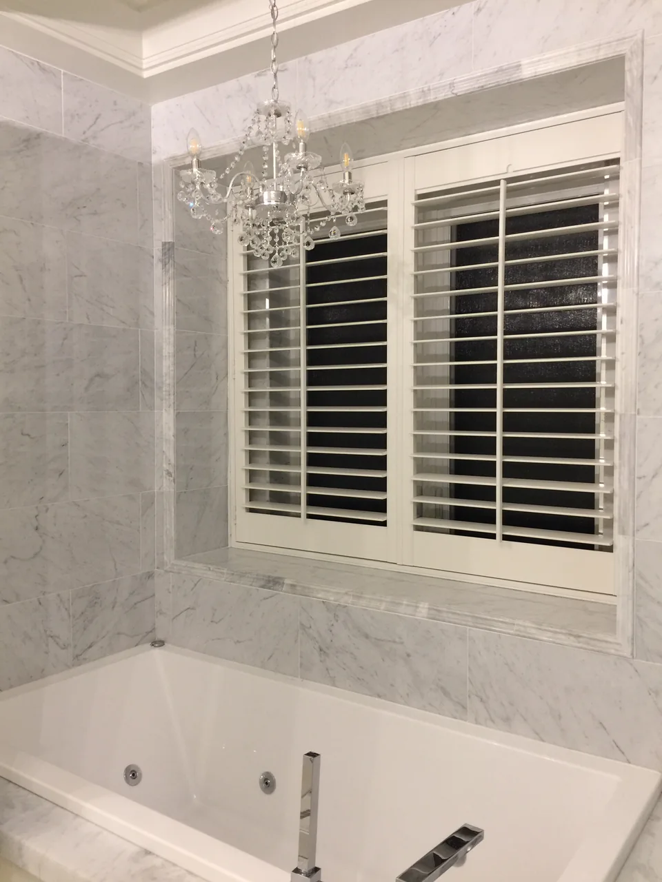 Shutters above the bathtub