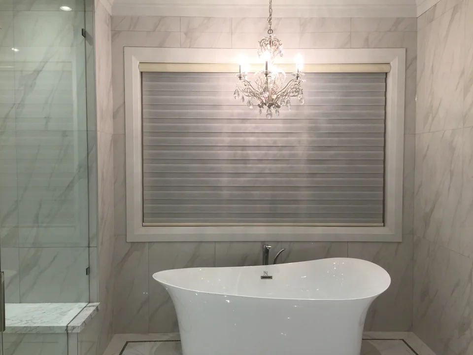Bathroom dual shades with bands aligned